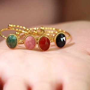 Vintage gold rope rings set with colorful oval stones in green pink red and black