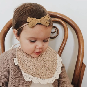 Baby girl floral lace bib and matching beige lace headband accessory set with warm knit cardigan