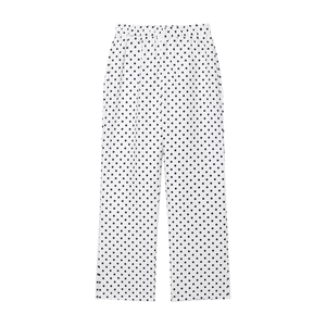 Pantalon à pois noirs et blancs avec taille élastique sur fond blanc