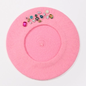 Detailed top view of pink wool beret featuring colorful rhinestone and gemstone embellishments