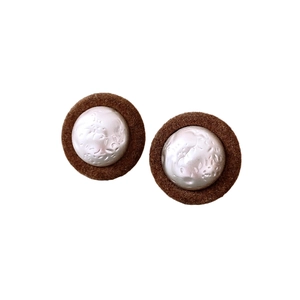 Retro round plush earrings with textured silver metal center in minimalist vintage style