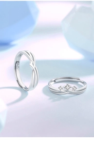 Close-up of S925 sterling silver couple rings with twisted bands and zircon accents