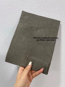 Close-up of thick grey microfiber magic cloth showing dense texture and absorbent fibers