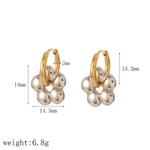 Detail view of flower-shaped huggie earrings with precise dimensions and metallic texture