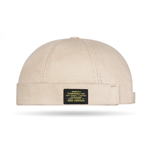 Beigefarbene Docker-Mütze aus Baumwolle mit Stofflabel im Vintage-Streetwear-Stil