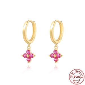 Macro view of S925 sterling silver four-leaf clover earrings with pink zircon inlays