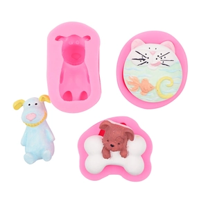 Detail of pink silicone molds for cartoon dog, cat, and fishbone DIY soap or resin crafts