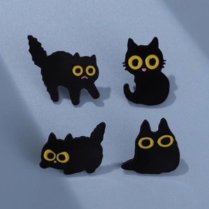 Set of four cute black cat enamel pins with yellow eyes for bags and clothing accessories