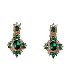 Vintage emerald and diamond oval drop earrings in gold finish with a luxury retro aesthetic