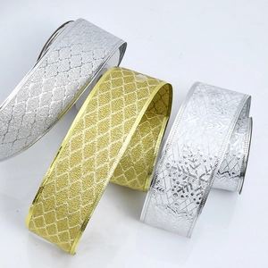 Detail of glitter diamond pattern Christmas ribbon with wired gold and silver edges