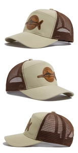 Detailed views of mesh trucker hat with leather marlin patch and curved brim design