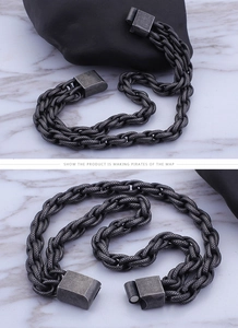 Close-up of vintage industrial steel braided bracelet with magnetic square clasp buckle