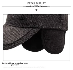 Detail showing plush lining earflaps and metal logo on a thermal winter baseball cap