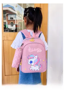 Toddler backpack with pink unicorn pattern and matching small star print hanging pouch