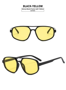 Detail of glossy black aviator sunglasses with yellow lenses and double bridge design