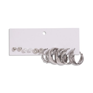 12-piece silver geometric earring set featuring classic hoops and pearl studs on white card