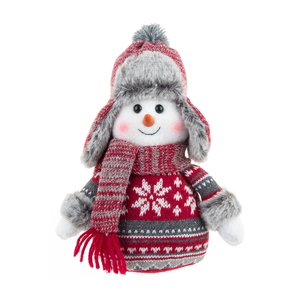 Detail of a plush snowman wearing a red and grey knit hat and snowflake pattern sweater