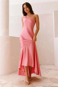 Detailed view of the pink satin one-shoulder dress with elegant asymmetrical fishtail hem