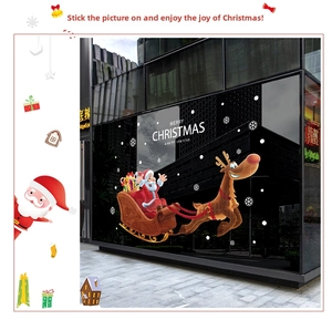 Detail of Christmas window stickers featuring Santa, reindeer, and snowflakes decorations