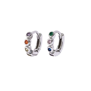 Detailed close-up of silver hoop earrings featuring vibrant multi-colored round gemstones