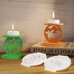 Macro view of silicone candle holder molds with mountain and forest pine designs