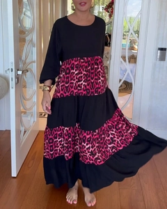 Detail of pink leopard print tiered patchwork on a long sleeve flowing maxi dress