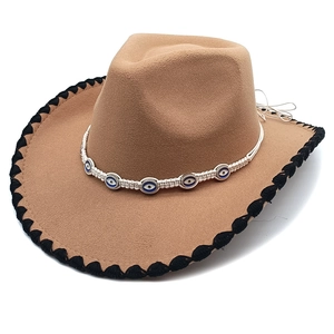 Brown wool felt cowboy hat with evil eye bead trim and black braided brim detail