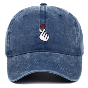 Detailed embroidery of a finger heart with a red heart on washed blue denim baseball cap
