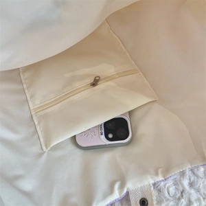 Detail view of the soft interior lining with a secure zipper pocket for smartphone storage