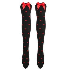 Detail view of black over-knee socks with red heart patterns and knitted bows
