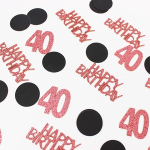 Detailed close-up of rose gold 40th birthday glitter confetti for party table decor