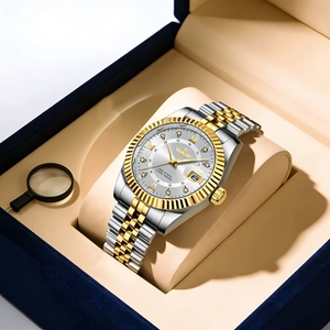 Detail of luxury men's steel watch with calendar and diamonds in a blue box
