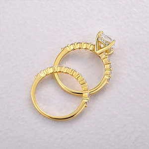 Detail of square gold ring set with sparkling pave-set stones and center crystal