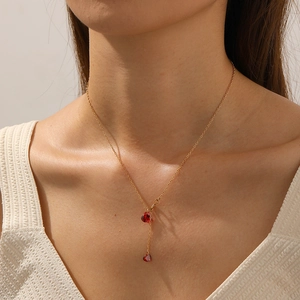French style gold plated stainless steel necklace with two red heart ruby pendants on model