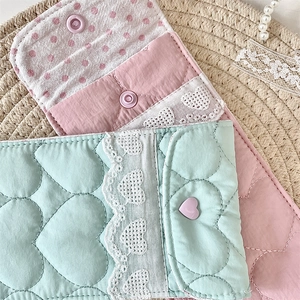 Detail of quilted cotton glasses pouches with lace edges and heart patterns