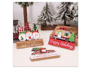 Close-up of wooden Christmas gnome and truck ornaments with Merry Christmas lettering
