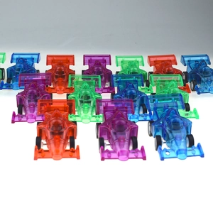 Close-up of colorful transparent mini F1 pull-back toy cars for kids' party favors
