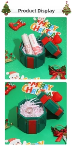 Octagonal Christmas gift box detail with heart handle and festive red-green colors