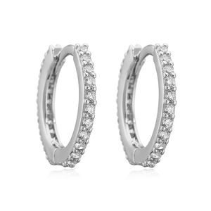 Detailed view of silver huggie earrings with micro-pave set round clear cubic zirconia