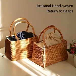 Handwoven rattan picnic basket with drawstring lining for vacation and storage