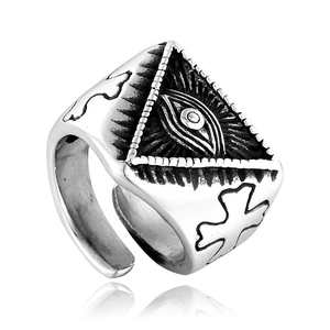 Macro detail of vintage All Seeing Eye ring with cross relief in retro silver finish