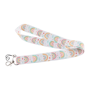 Detailed view of white rainbow pattern lanyard with metal lobster clasp and cord loop
