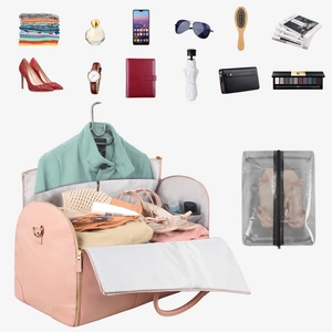 Detail view of pink PU leather garment bag interior with large storage capacity