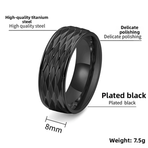 Detail view of 8mm wide black titanium steel ring with diamond pattern engraving