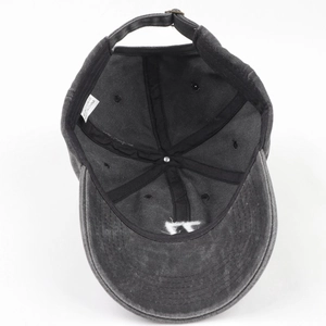 Detail of washed cotton baseball cap interior showing 6-panel stitching and sweatband