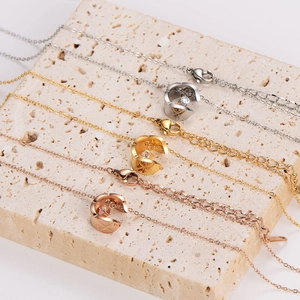 Quilted geometric C-shape pendant necklaces in silver, gold, and rose gold finish