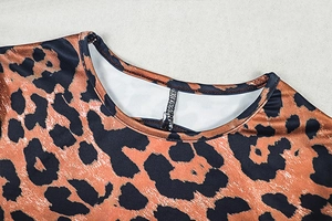 Close-up of the crew neck collar and leopard print stitching on the slim jumpsuit