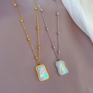 Gold and silver mermaid-style titanium necklaces with irregular iridescent square pendants