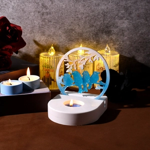 Detailed view of DIY silicone mold for bird candle holder with round resin centerpiece