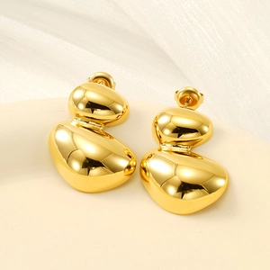 Minimalist irregular geometric oval earrings in gold finish with a high-polished mirror effect